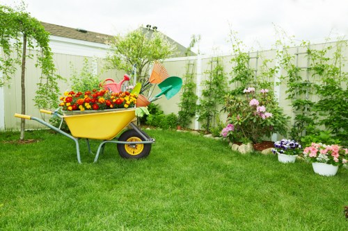 Garden clearance crew removing green waste from a terraced house plot